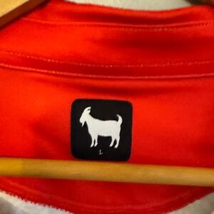 Goated Golf elephant print polo.